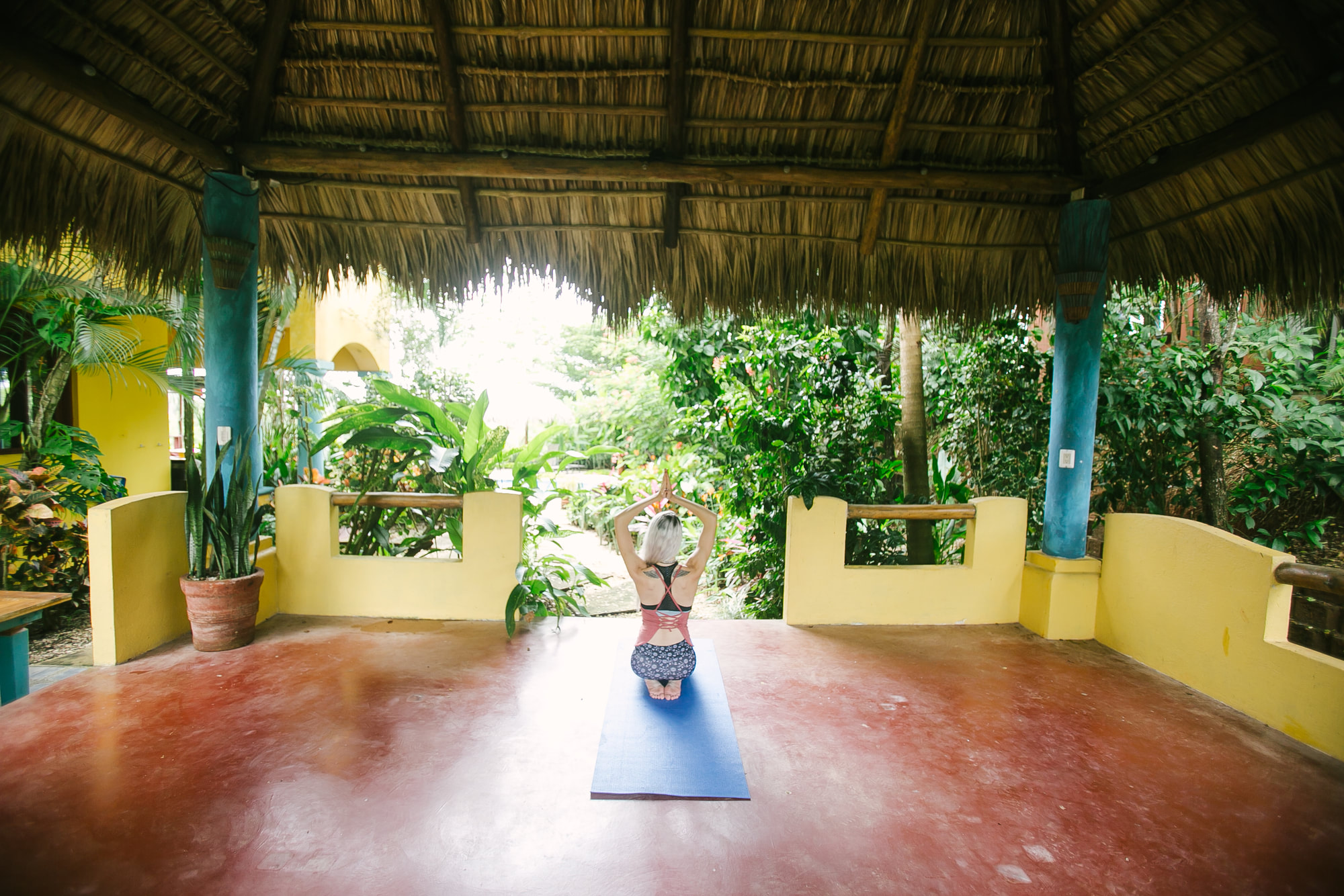 Covered tropical group space surrounded by greenery